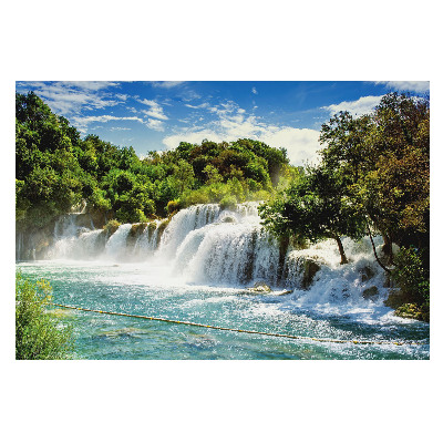 Tapeta s motívom vodopádu v slnečnej zelenej scenérii