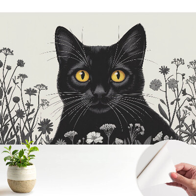 Tapety na stenu samolepiace Čierna mačka so žltými očami medzi kvetmi
