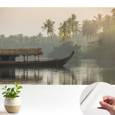 Tapeta na stenu samolepiaca s motívom mystickej krajiny s loďou a palmami