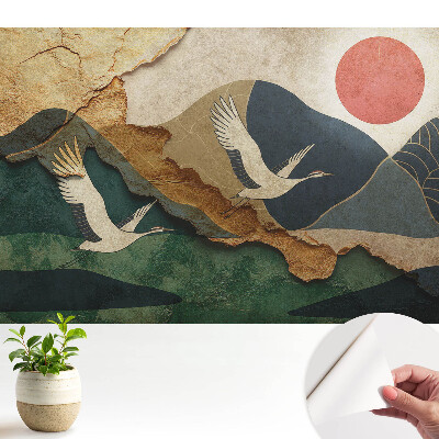 Tapeta so žeriavmi a scenériou pri červenom západe slnka