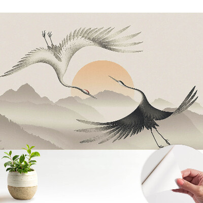 Tapeta do obývačky s motívom žeriavov nad horami zobrazujúca prírodu v harmónii