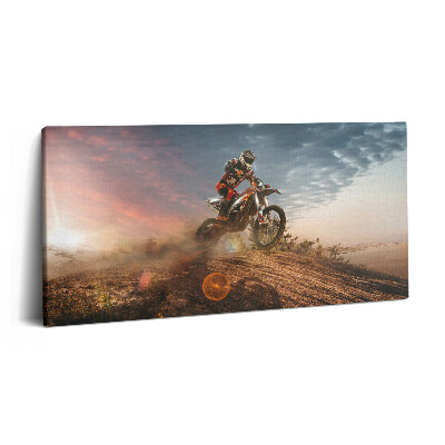 Obraz na plátne 100x50 Motokrosový jazdec pri západe slnka.