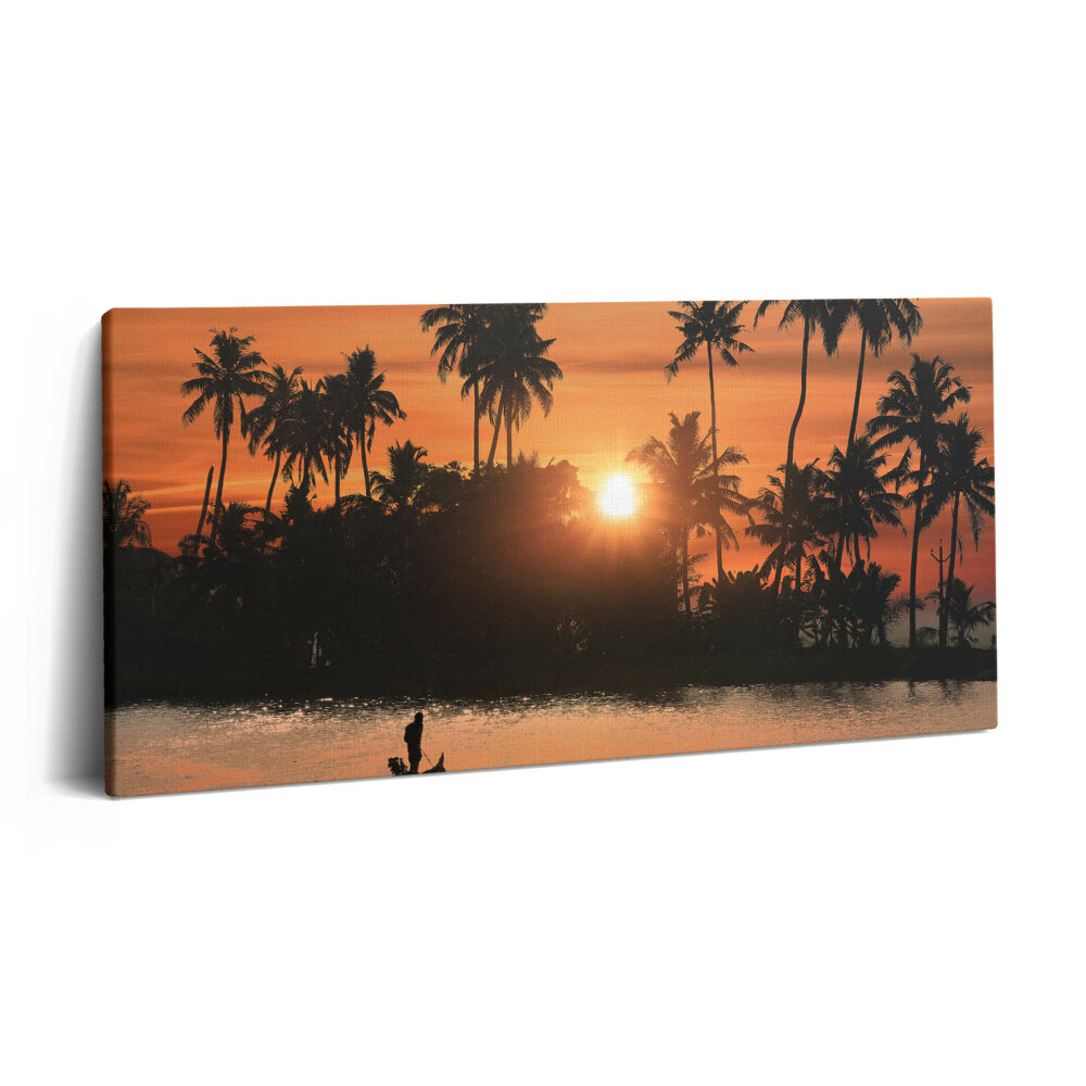 Fotoobraz na plátne 120x60 Západ slnka za palmami pri rieke