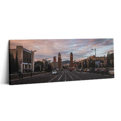 Obraz na plátne 125x50 Večerná ulica s vežami