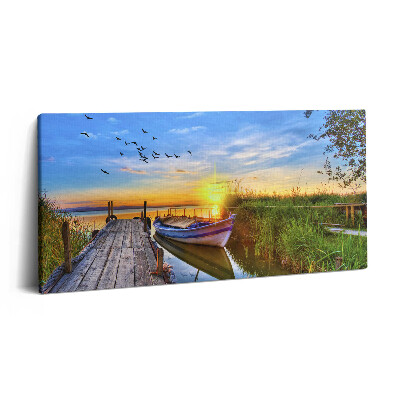 Fotoobraz na plátne 140x70 Loďka pri západe slnka na jazere
