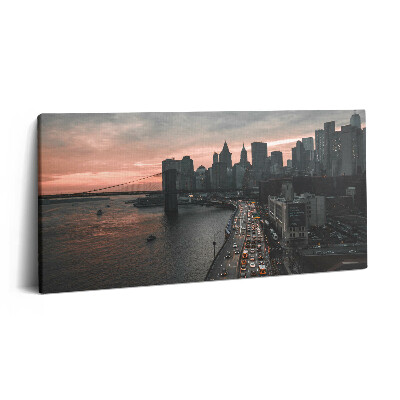 Obraz na plátne 140x70 Most a mesto pri západe slnka